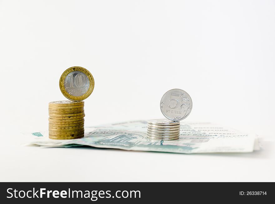 Two small piles of metal coins