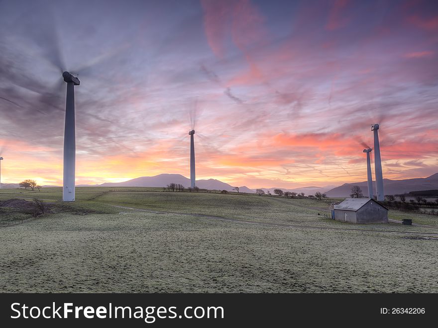 Shot taken of the Armaside Farm (Lake District) wind turbines on a winters morning. The sun was just rising. Some noise due to the long exposure used. Motion blur in the Wind turbines propellers. The Sun hadnt risen and the shot is lit only by ambient light. Some motion blur for the sheep moving around the landscape. Shot taken of the Armaside Farm (Lake District) wind turbines on a winters morning. The sun was just rising. Some noise due to the long exposure used. Motion blur in the Wind turbines propellers. The Sun hadnt risen and the shot is lit only by ambient light. Some motion blur for the sheep moving around the landscape