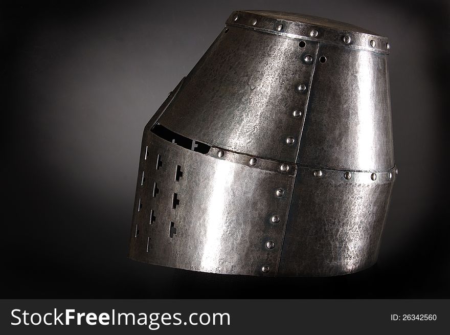 Iron helmet of the medieval knight. Very heavy headdress.