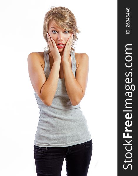 Studio portrait of a beautiful blonde girl with the emotion of surprise