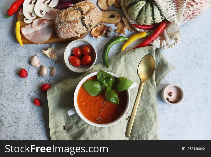 Hot Tomato Soup With Bread And Vegetables