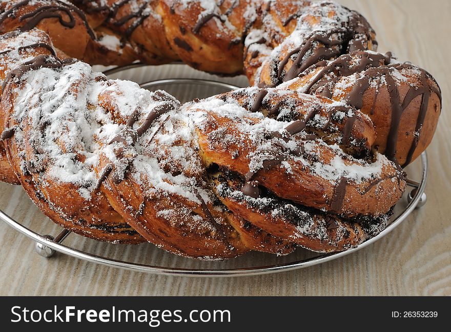 Poppy seed roll, garnished with chocolate and powdered sugar. Poppy seed roll, garnished with chocolate and powdered sugar