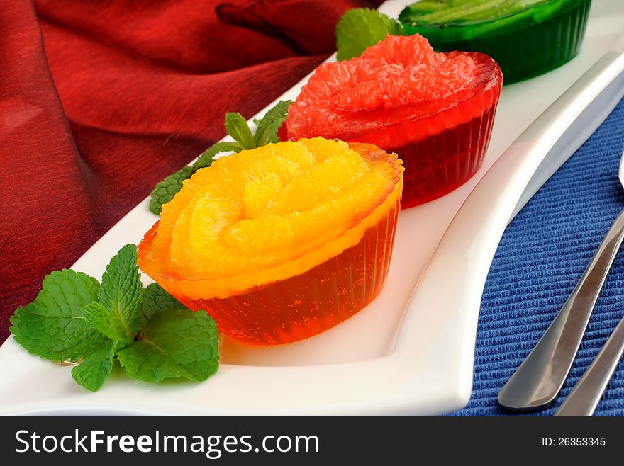 Dessert of orange jelly with fresh orange slices with. Dessert of orange jelly with fresh orange slices with