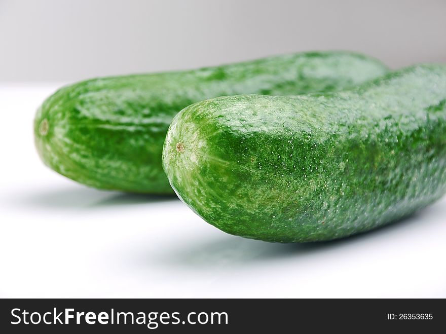 Green cucumber on white background