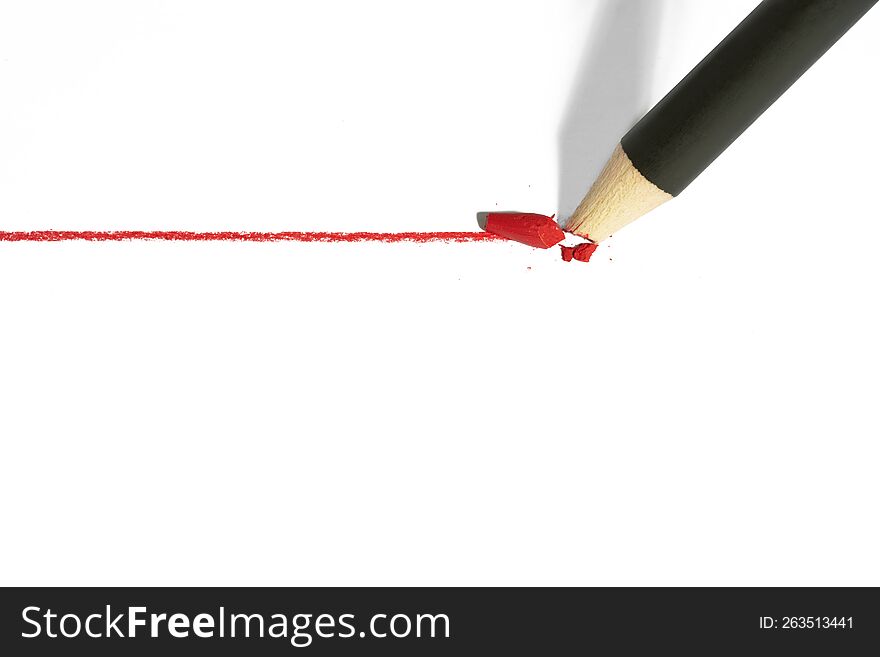 Red pencil with a broken rod drawing a line, isolated