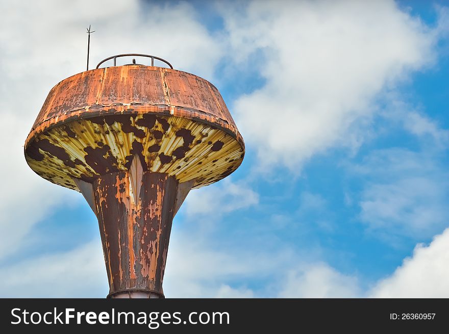 Head of water tower on blue sky