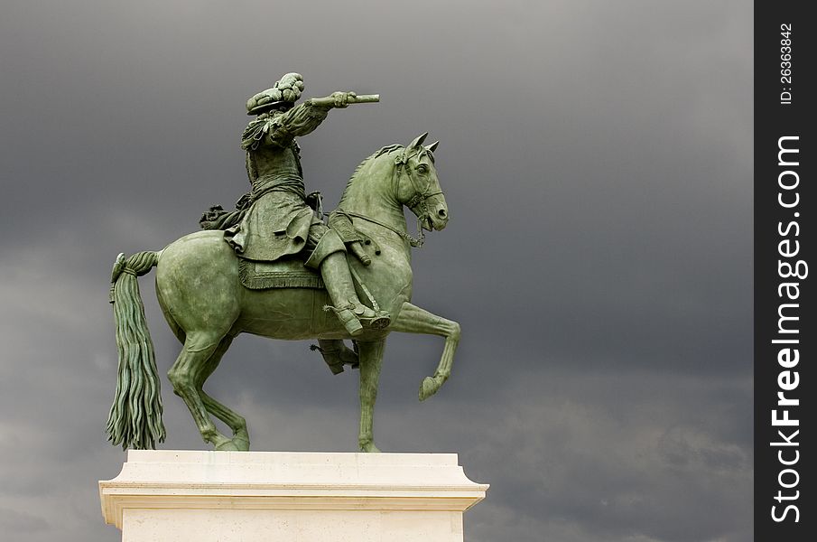 Horse and scholar Statue against a grey sky. Horse and scholar Statue against a grey sky