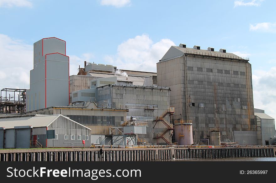 A Large Industrial Factory on a Riverbank. A Large Industrial Factory on a Riverbank.