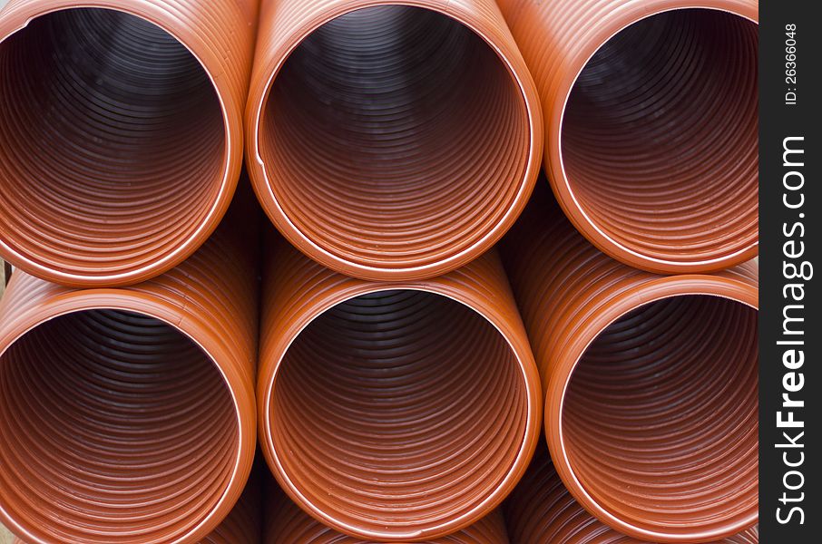 Orange discharge sewage pipes in the ground