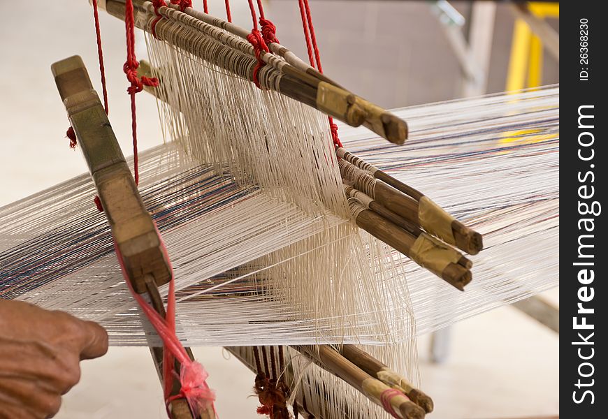 Part of thread on weaving apparatus