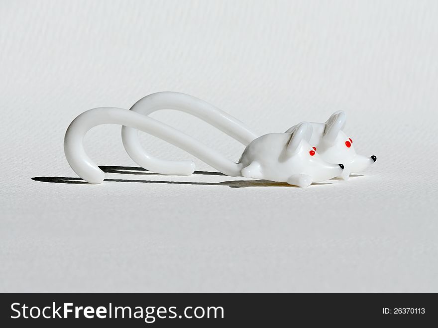 Two mice from white glass with red eyes. Two mice from white glass with red eyes.