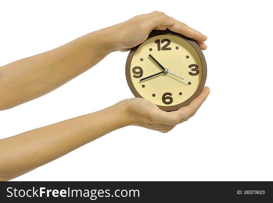Hand holding clock isolated over white background. Overtime concept