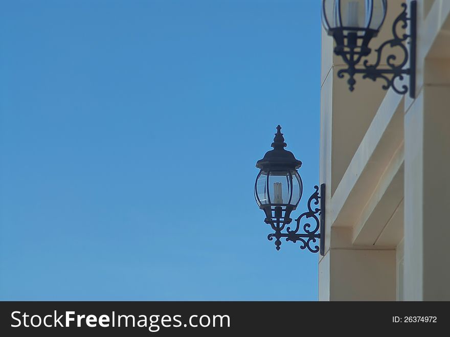 Outdoor wall lamp and blue sky