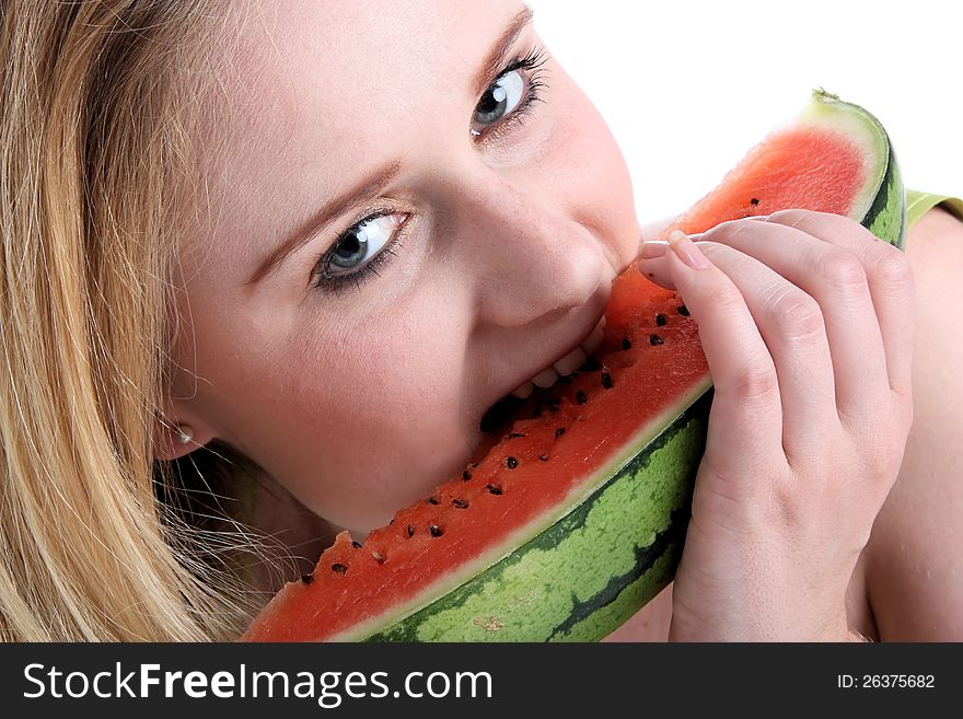 Girl eating a red melon. Girl eating a red melon
