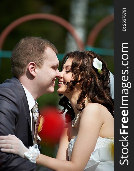 Happy groom and bride in wedding walk