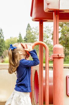 Little Girl On Playground Stock Photo