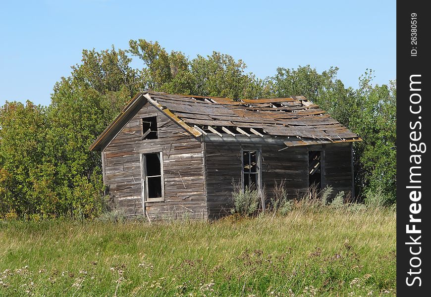 Old Rural Abandoned Wooden Collapsing House.