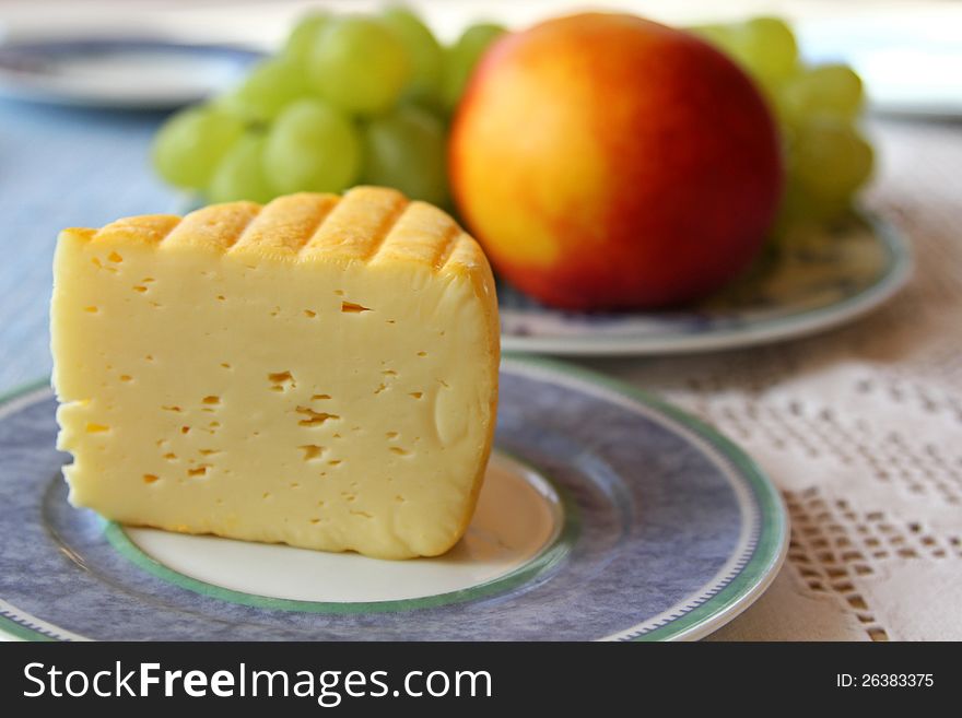 Mondseer Cheese With Fruit Background