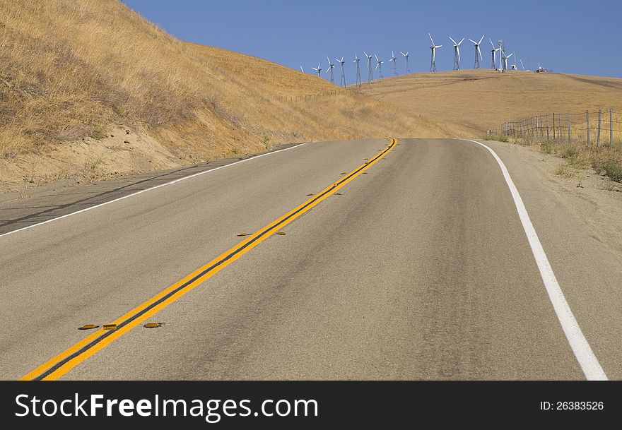 A California side road leads to a sizable wind farm. A California side road leads to a sizable wind farm