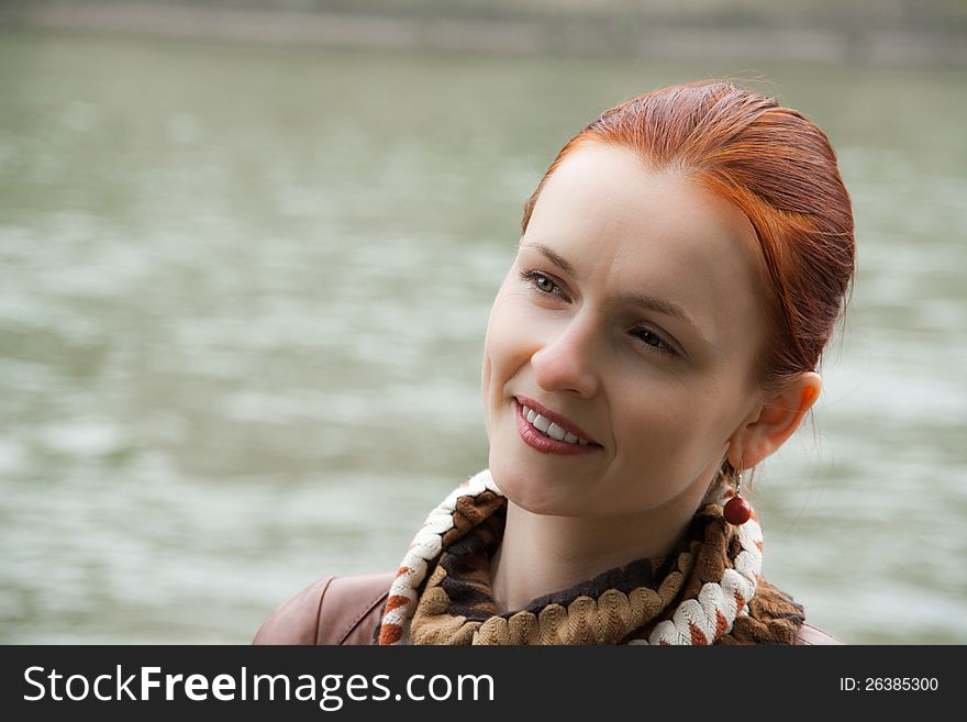 A beautiful lady with red hair, giving a gentle smile. A beautiful lady with red hair, giving a gentle smile