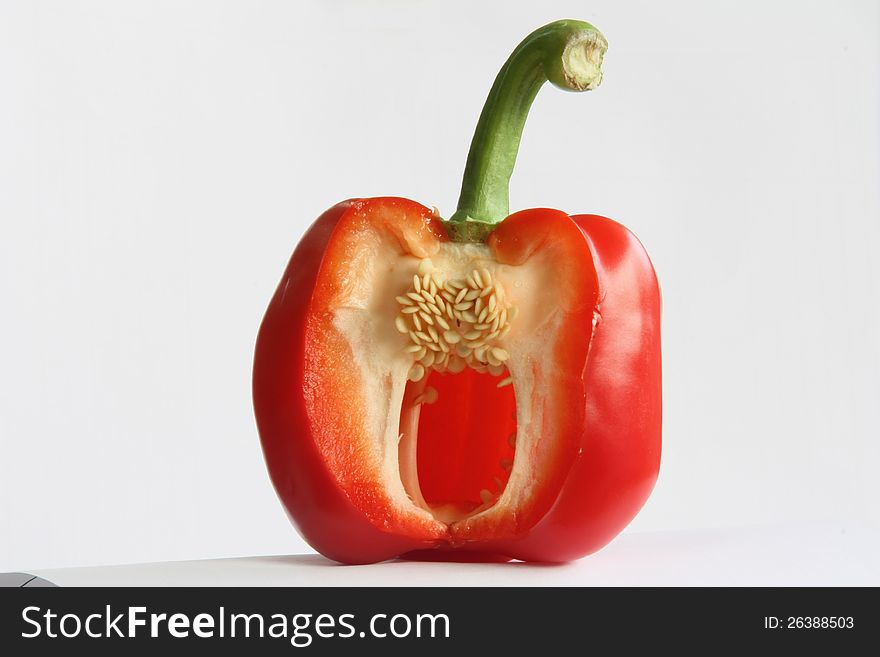 fresh red bell pepper, with countable seeds inside, also the cutting edge is very fresh and clear.  fresh red bell pepper, with countable seeds inside, also the cutting edge is very fresh and clear.