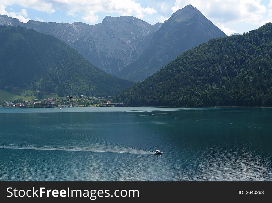 Achensee Austia , Lake in Alps , June 2007 . Small white Ship Not so far from Innsbruck . Achensee Austia , Lake in Alps , June 2007 . Small white Ship Not so far from Innsbruck .