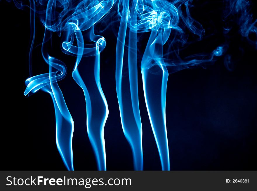 Light blue smoke waves over black background