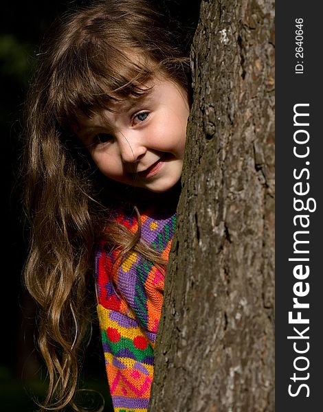 Little girl playing in the forest. Little girl playing in the forest