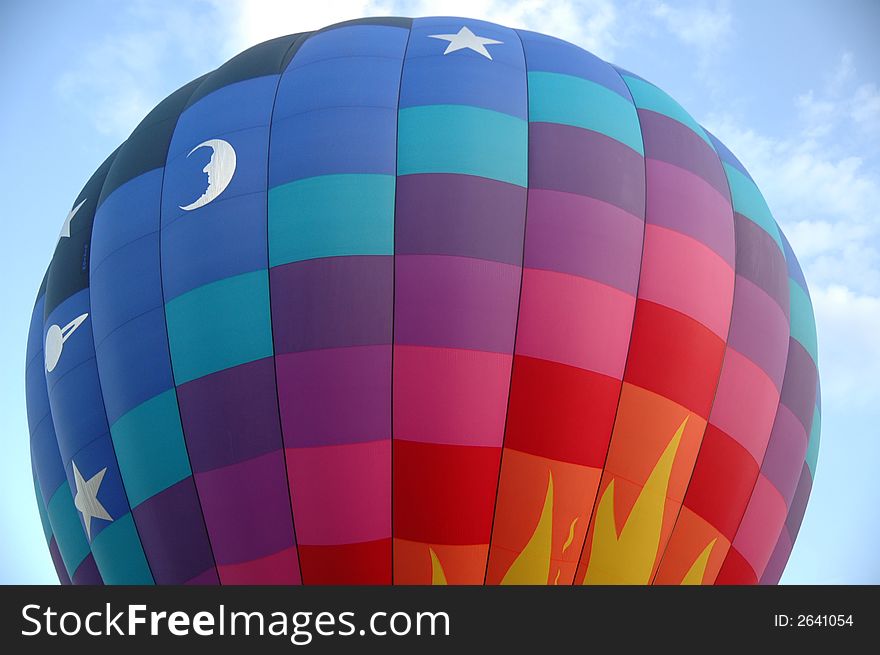 Closeup of colorful hot air balloon against  the blue summer sky