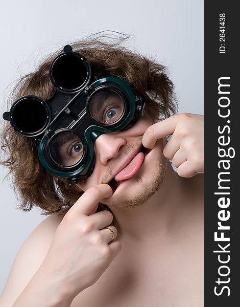 Farcical man wering welding glasses