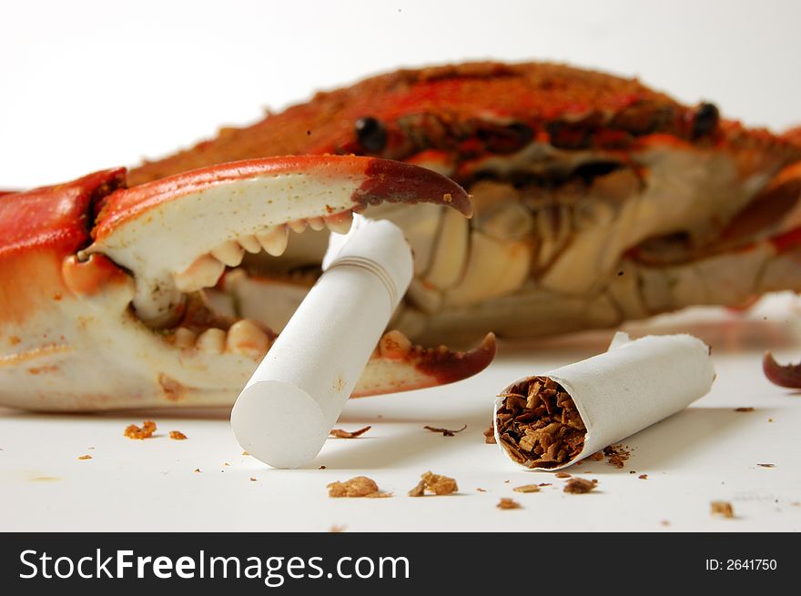 Symbol not smoking, a crabs cuts a cigarette. Symbol not smoking, a crabs cuts a cigarette
