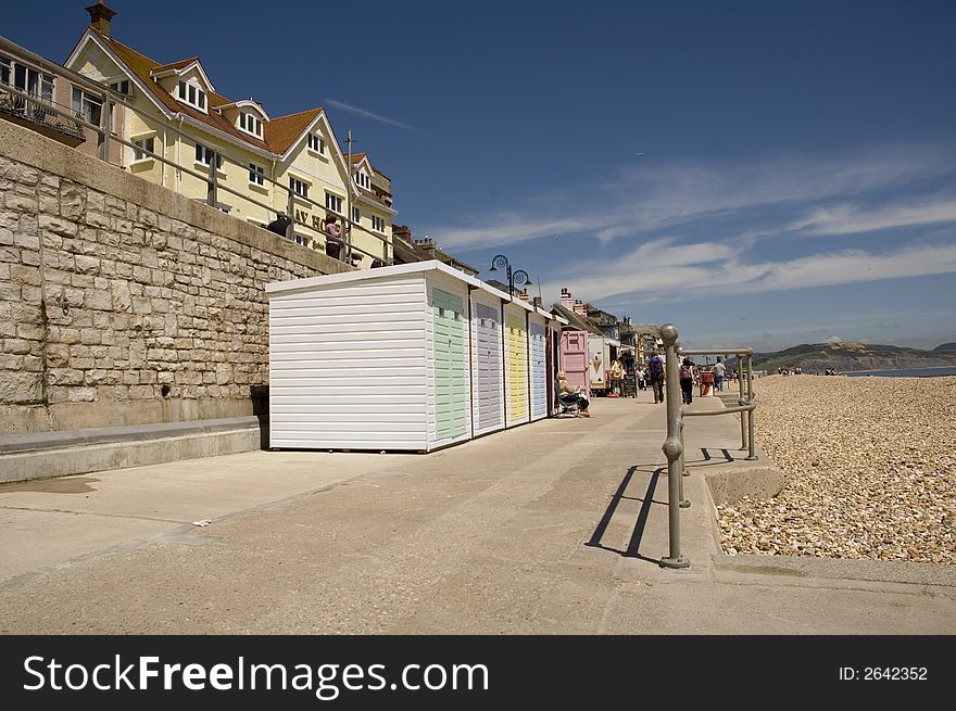 Colorful beachfront changing cabins at Lyme Regis in Dorset. Colorful beachfront changing cabins at Lyme Regis in Dorset