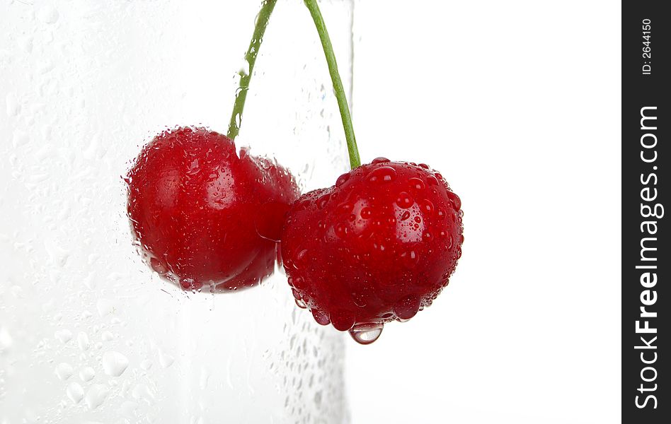 Fresh cup of cherries. white background