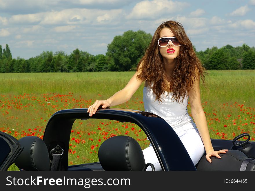 Beautiful girl look out from the cabrio. Beautiful girl look out from the cabrio