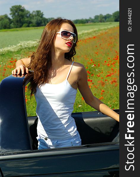 Beautiful girl look out from the cabrio. Beautiful girl look out from the cabrio