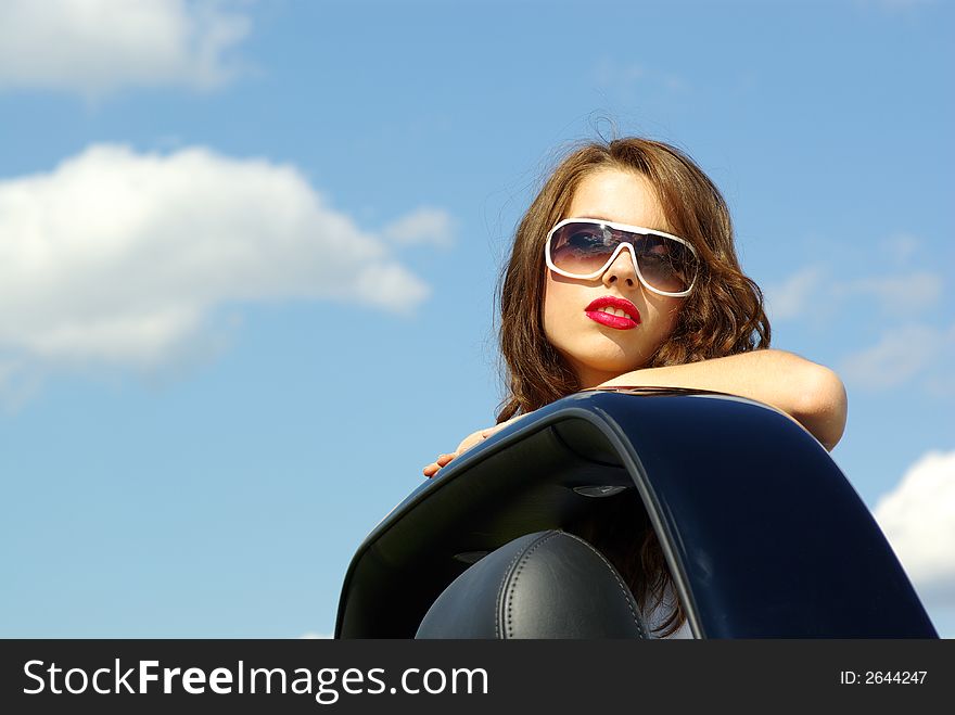 Beautiful girl look out from the cabrio. Beautiful girl look out from the cabrio