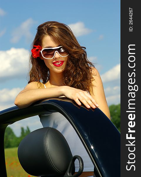 Beautiful girl look out from the cabrio. Beautiful girl look out from the cabrio