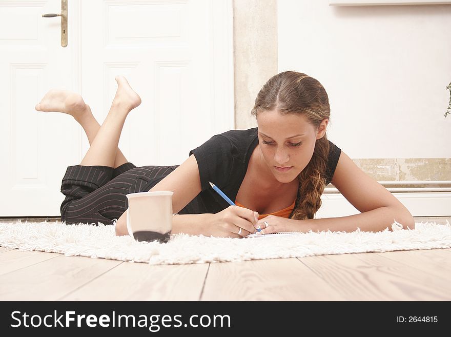 Fifteen year old girl is posing on the ground. Fifteen year old girl is posing on the ground