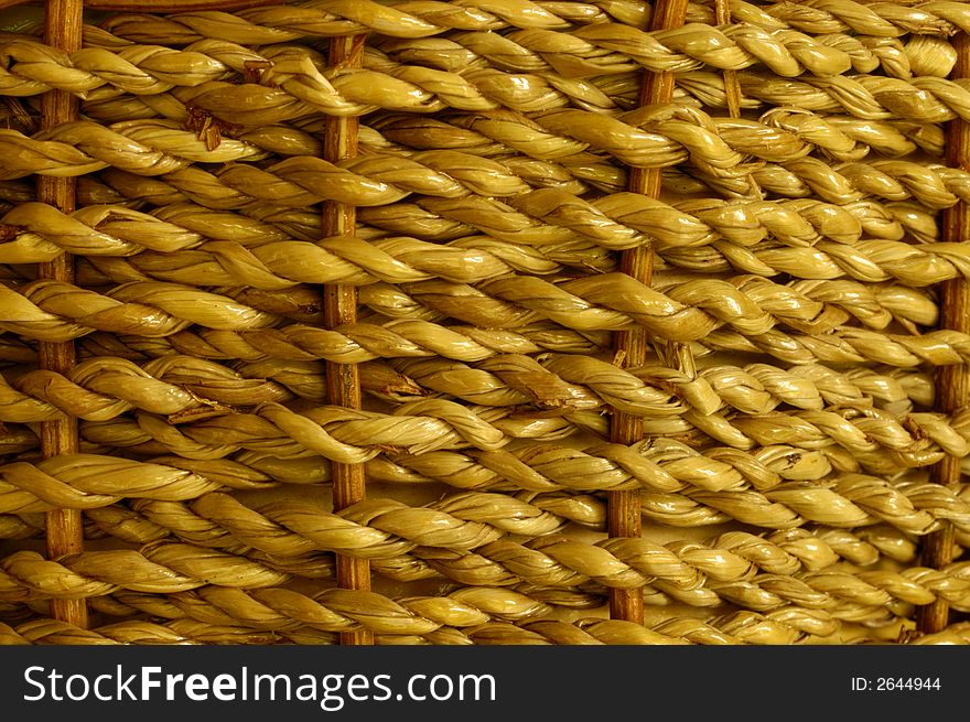 Stock macro photo of the texture of a basket woven from grass cord. The basket is wet and shiny. Useful for layer masks or as a patterned background. Focus falls off at RH edge to give depth to the image. Stock macro photo of the texture of a basket woven from grass cord. The basket is wet and shiny. Useful for layer masks or as a patterned background. Focus falls off at RH edge to give depth to the image.