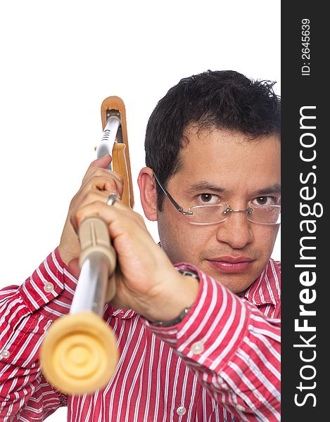 Close up portrait of Latino man against a white background pointing the end of a crutch toward the viewer. Close up portrait of Latino man against a white background pointing the end of a crutch toward the viewer.