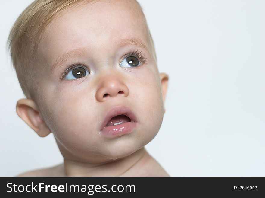 Image of beautiful toddler with a serious look on his face. Image of beautiful toddler with a serious look on his face