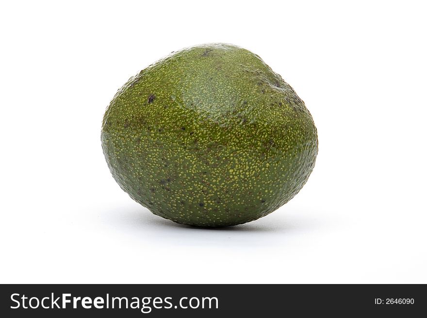 A single whole avocado pear on a white background