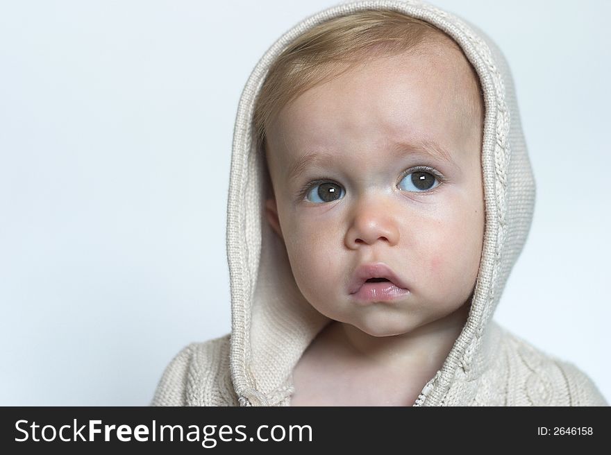 Image of beautiful toddler wearing a hooded sweater. Image of beautiful toddler wearing a hooded sweater