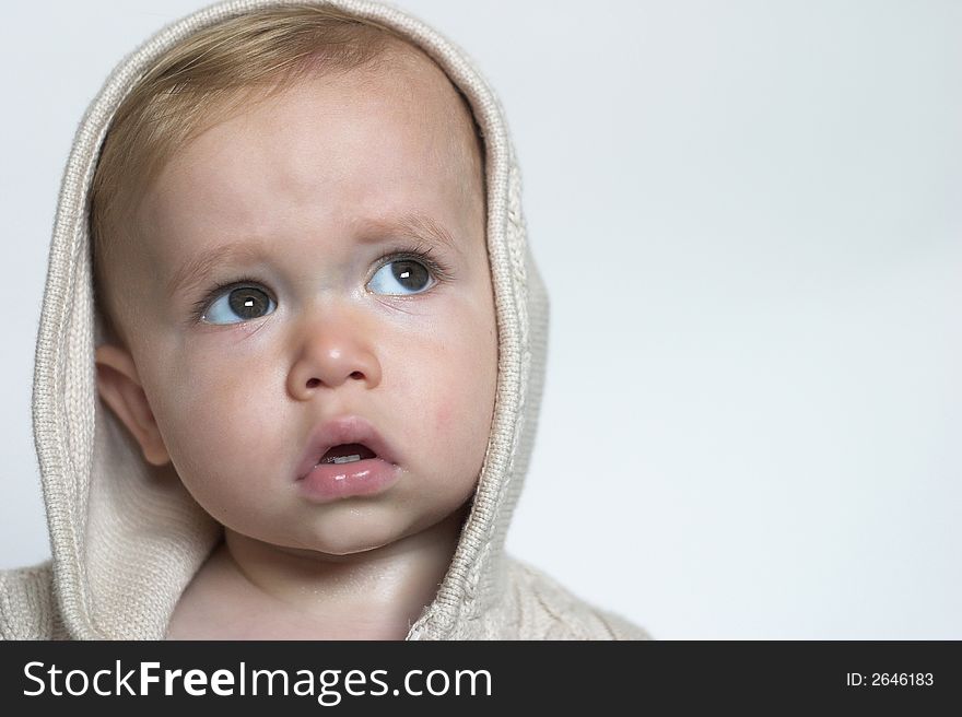 Image of beautiful toddler wearing a hooded sweater. Image of beautiful toddler wearing a hooded sweater