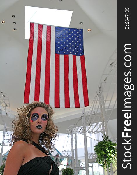 Extreme makeup model in mall under U.S. Flag. Extreme makeup model in mall under U.S. Flag