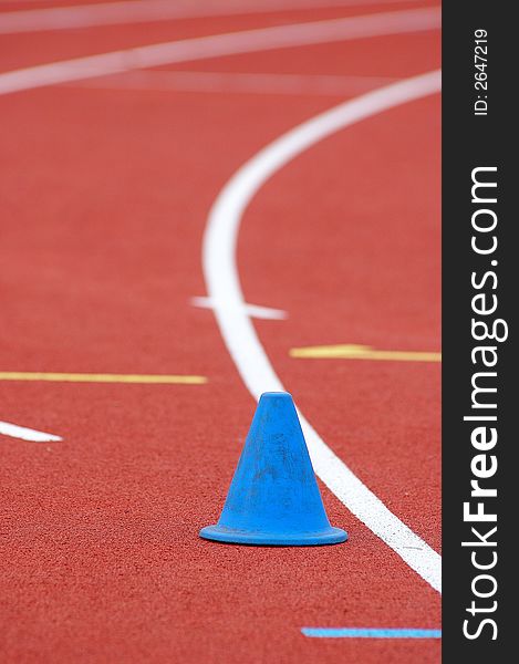 Photography of an athletics trail and line and cone