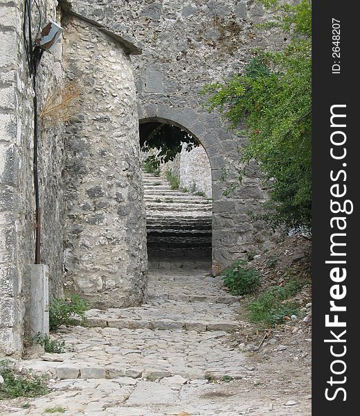 Old stone arch and stairs in ancient castle