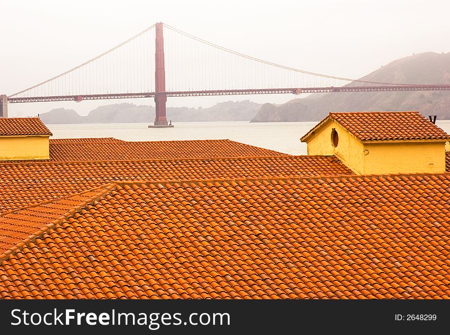Golden Gate Bridge, viewed across the red tile roofs of Fort Mason. Golden Gate Bridge, viewed across the red tile roofs of Fort Mason.