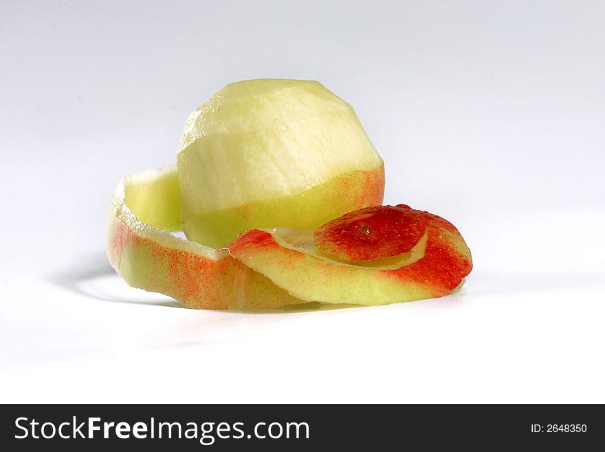 Nice view of fresh apple with its peel on the white background. Nice view of fresh apple with its peel on the white background