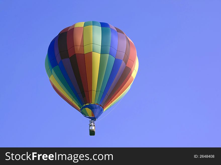 Hot air balloon above trees